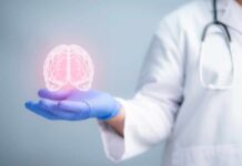 Shocking Brain Rejuvenation Hack A medical professional holding a glowing digital brain illustration in their hand