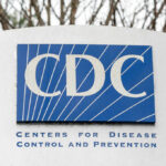 Are Lyme and COVID Merging Into One Illness? Sign displaying the CDC logo and full name, Centers for Disease Control and Prevention