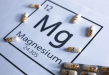 Magnesium element symbol with colorful capsules arranged around it