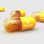 Vitamin D’s Alarming Role In The Opioid Crisis Vitamin D capsules with orange beads inside