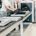 Ebola Hits Paris — That’s Not The Scary Part Passengers placing items on a conveyor belt at an airport security checkpoint