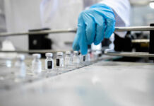 Fentanyl Vaccine Hype—What’s Being Hidden? A healthcare professional in a lab preparing vaccine vials