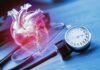 Cancer Clues Hiding In Heart Scans An anatomical heart illustration next to a blood pressure monitor