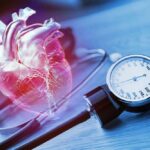 Cancer Clues Hiding In Heart Scans An anatomical heart illustration next to a blood pressure monitor