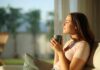 The Hidden Danger of Self-Optimization Woman enjoying a cup of coffee in a sunlit room
