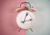 Why Fasting is not Recommended After 60 An alarm clock with a plate and two forks arranged in a creative design