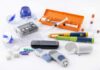 Diabetes management tools and supplies on a white surface