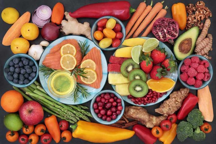 Assorted fruits, vegetables, and salmon slices on plates