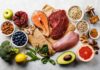 Painful Gout Risk SLASHED By Simple Diet Assorted healthy foods with salmon, beef, chicken, fruits, vegetables, nuts, and grains