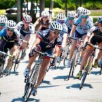 Valérie Maltais, Amy Pieters, Gianni Meersman, and Michael Špaček racing in a cycling peloton