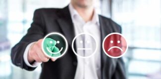 Businessperson selecting a happy face rating icon