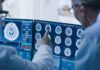 Midlife Brain Switch Stuns Scientists Doctors reviewing brain MRI scans on multiple monitors