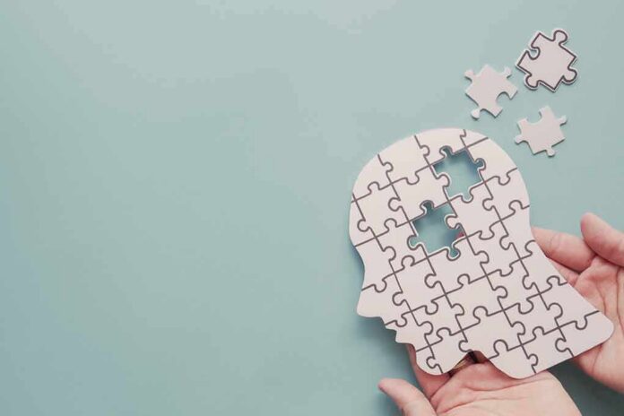 human head puzzle silhouette with missing pieces