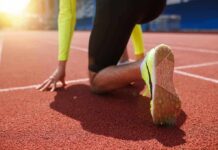 sprinter at starting blocks on track