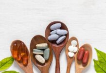 Vitamin Trio That Outsmarts Aging Assorted dietary supplements on wooden spoons