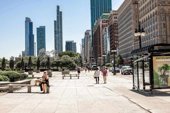 City street with pedestrians and tall modern skyscrapers