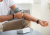 Blood Pressure Hack: Hold Still, Drop Points Man checking blood pressure at home