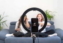 TikTok wellness trends & hacks worth buying into smartphone on ring light filming two people on a couch
